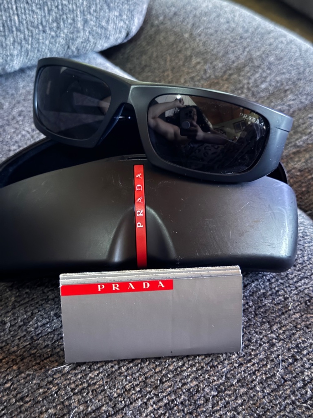 Prada Black Sunglasses with Dark Lenses